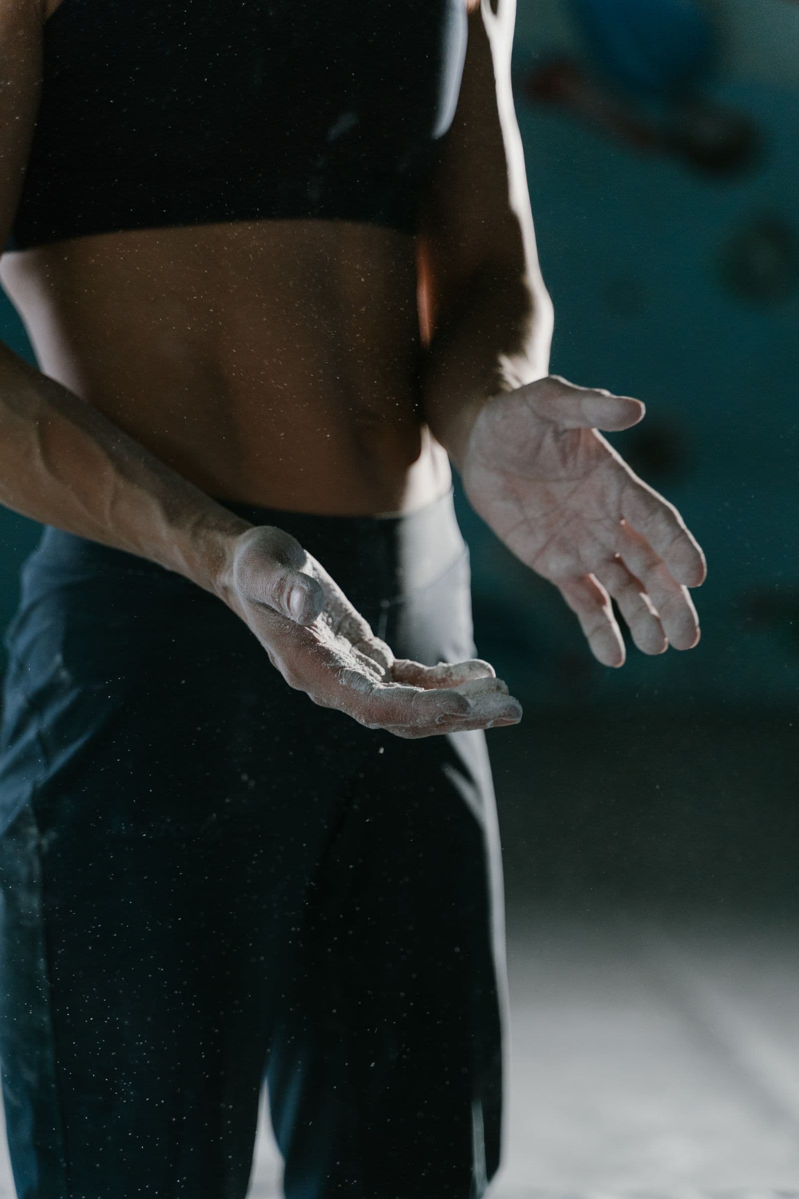 Climber's chalk-covered hands before a session