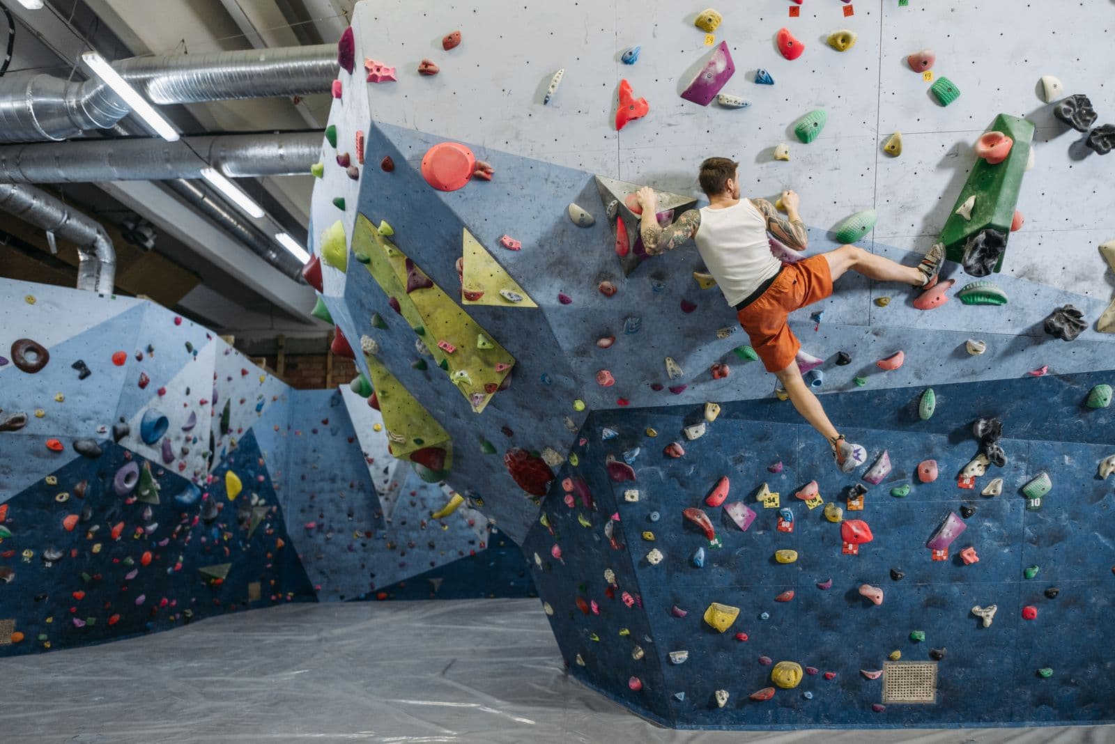 Climber on an indoor bouldering wall
