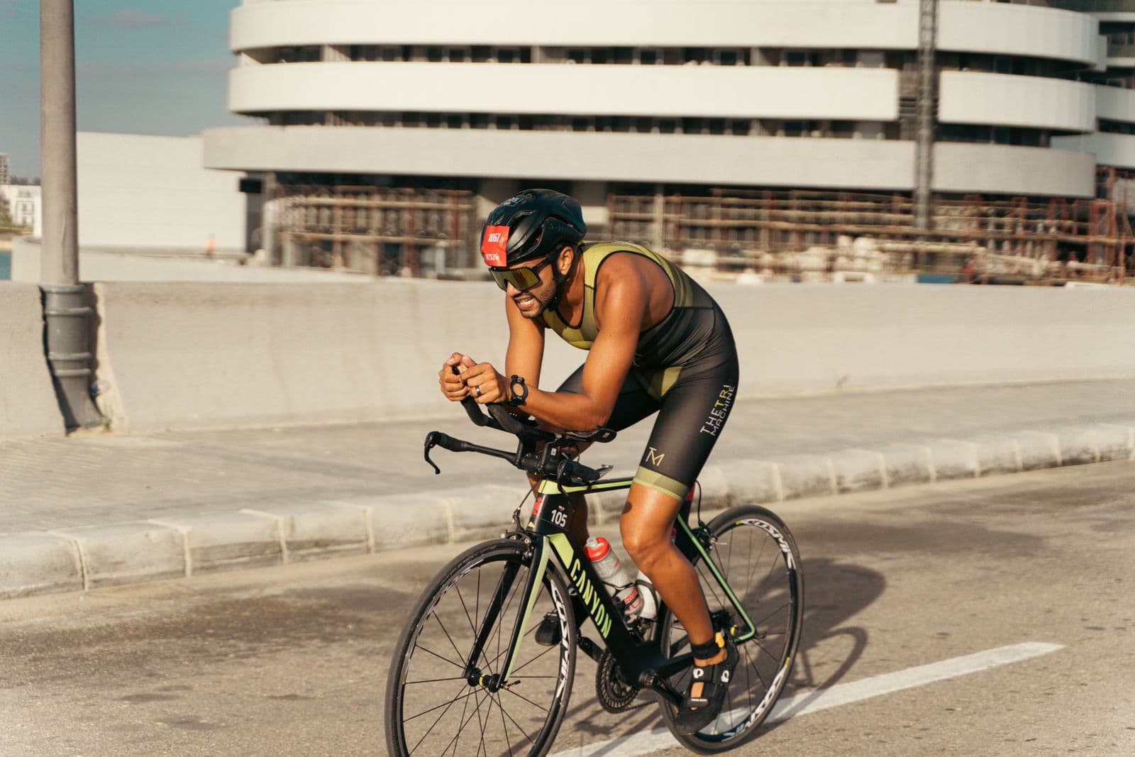 Cyclist in an aggressive aero position on the road