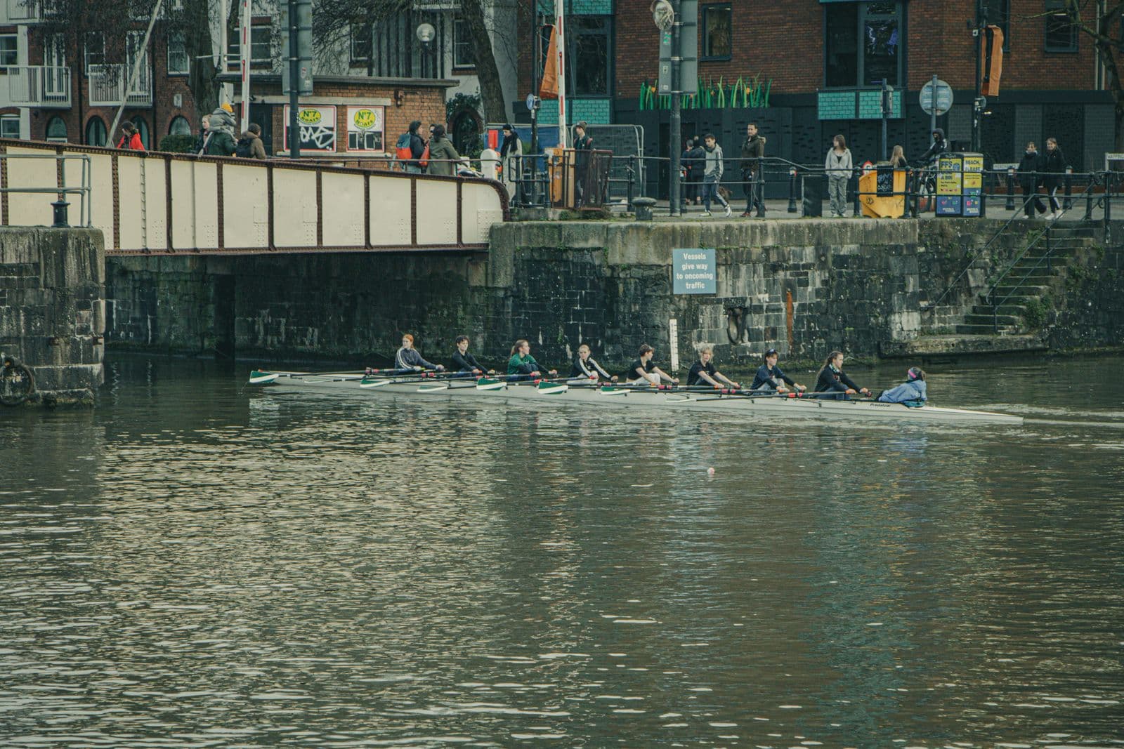 Junior crew practicing on a city river