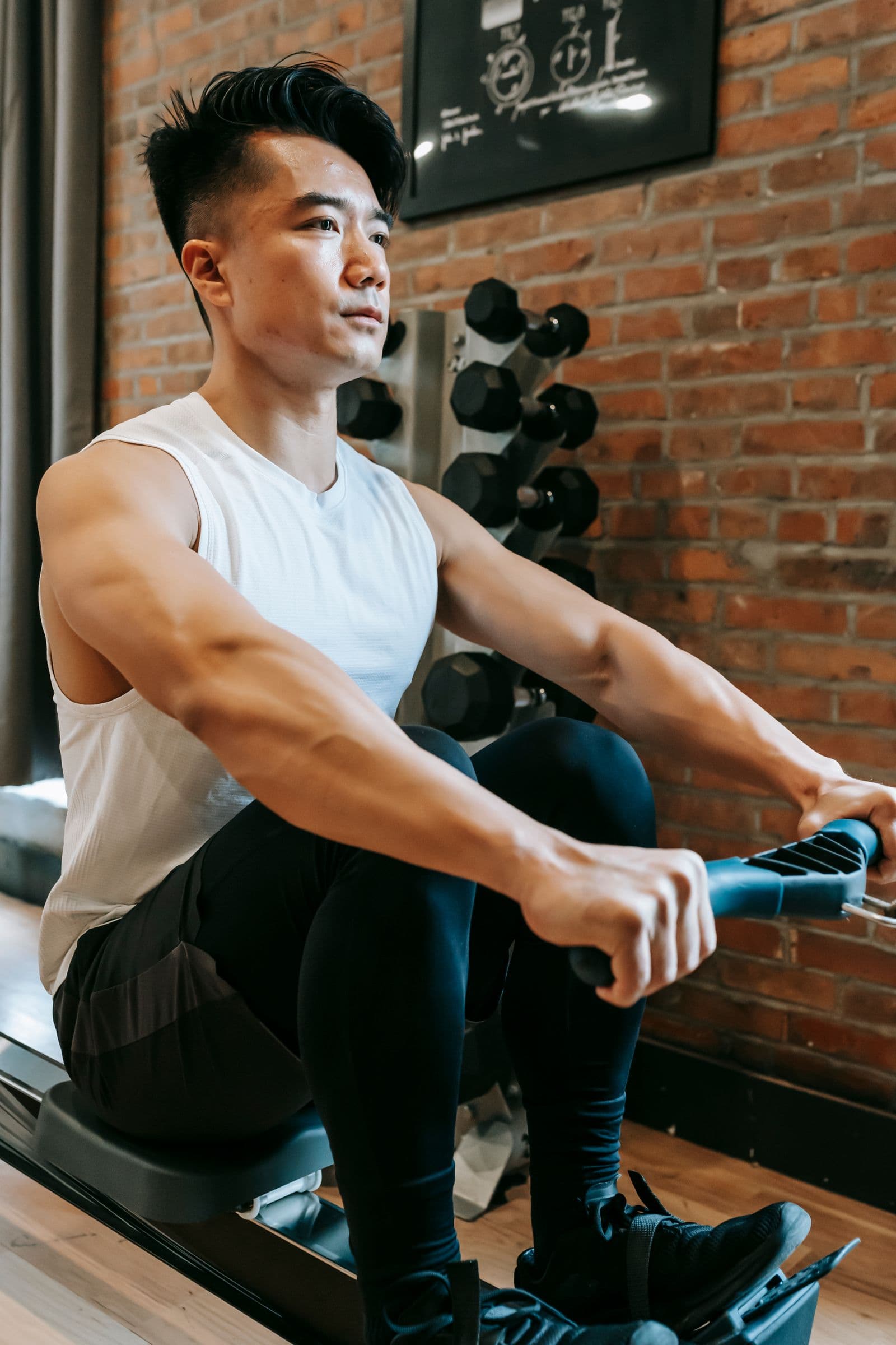 Rower compressed at the catch on an erg