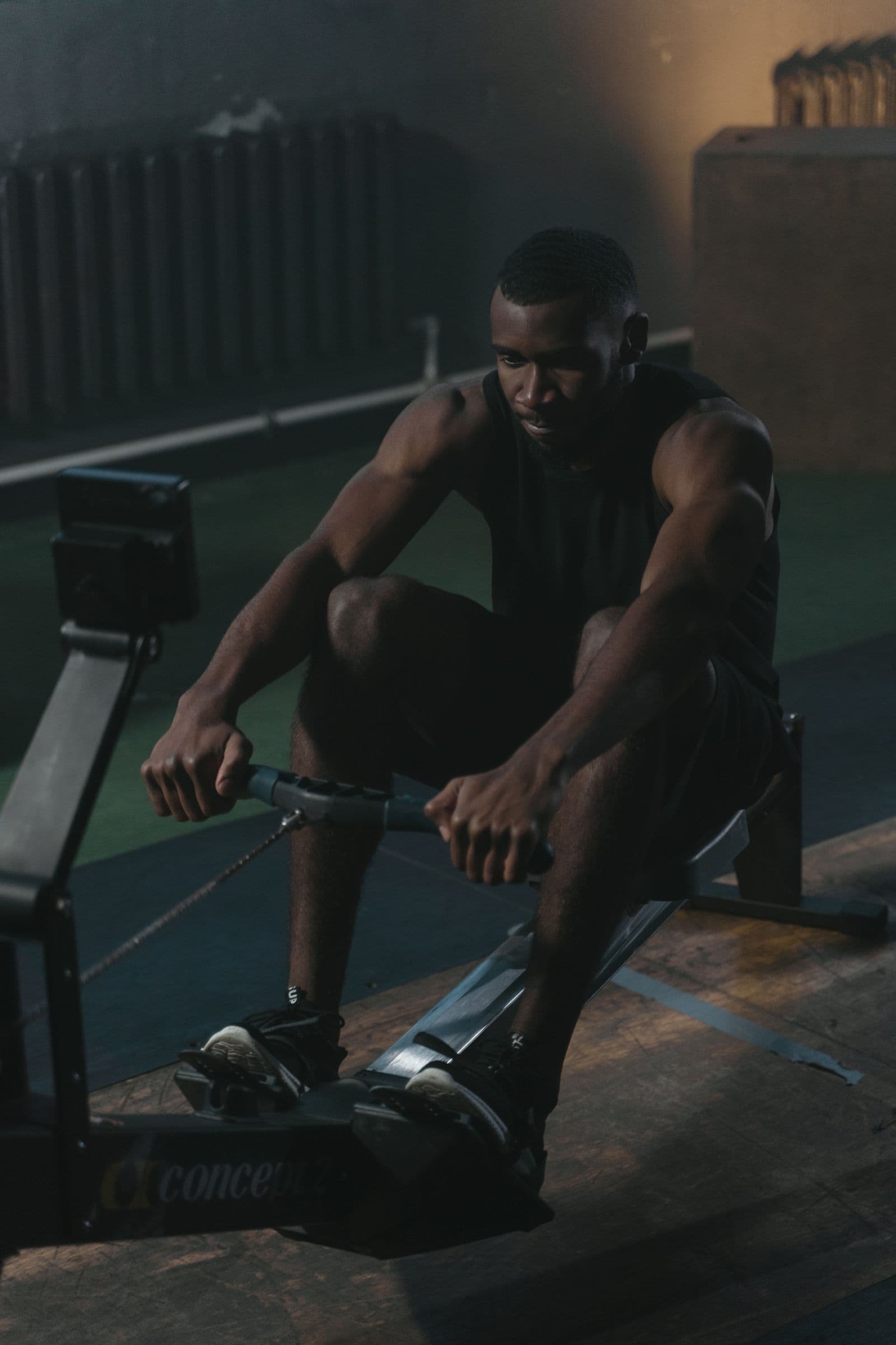 Rower focused mid-piece on an indoor erg