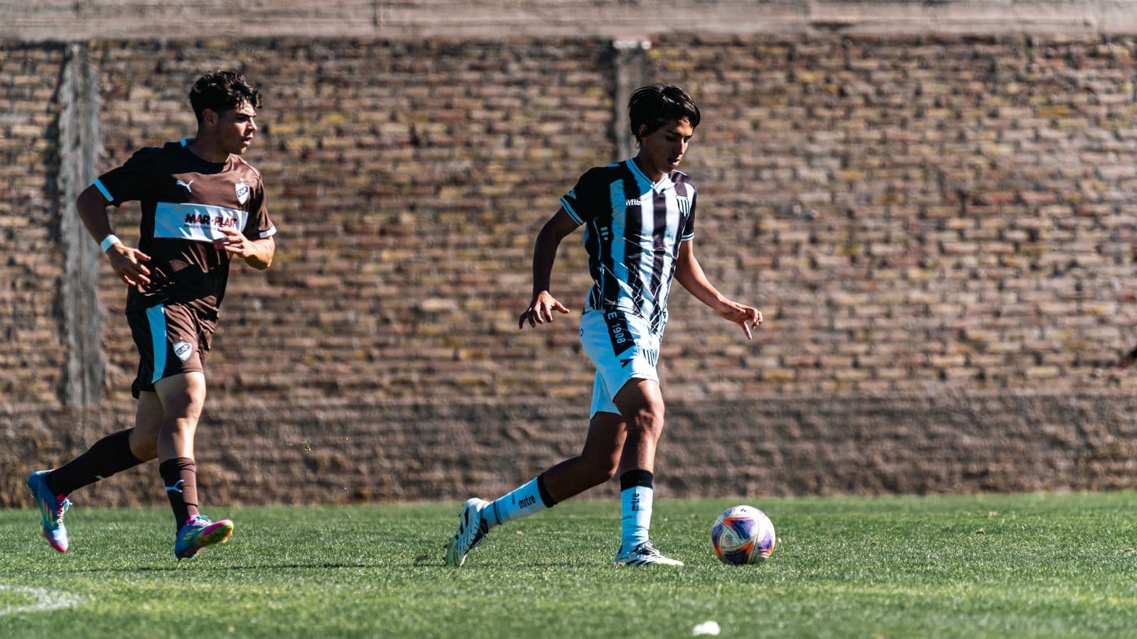 Players during a casual soccer game on a grass field