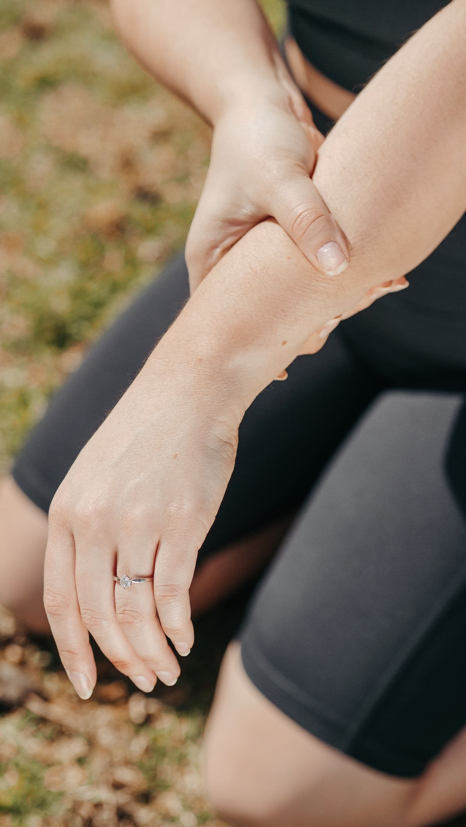 Athlete holding her wrist in discomfort