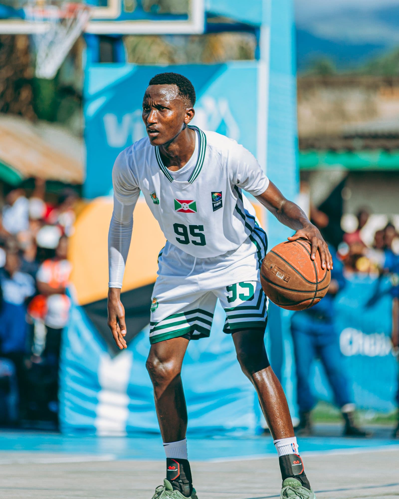 Player dribbling on an outdoor basketball court
