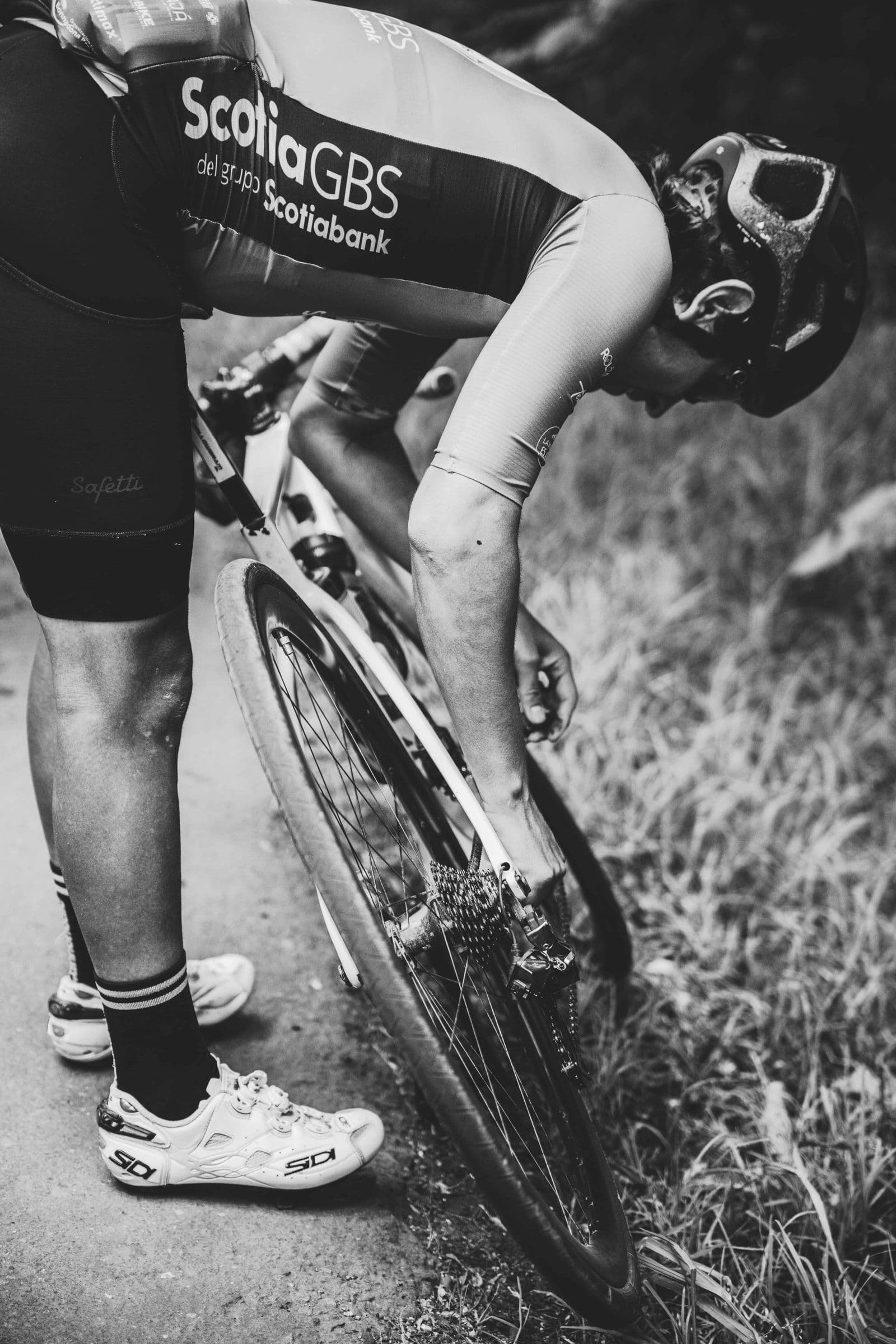 Rider adjusting the setup of a bicycle