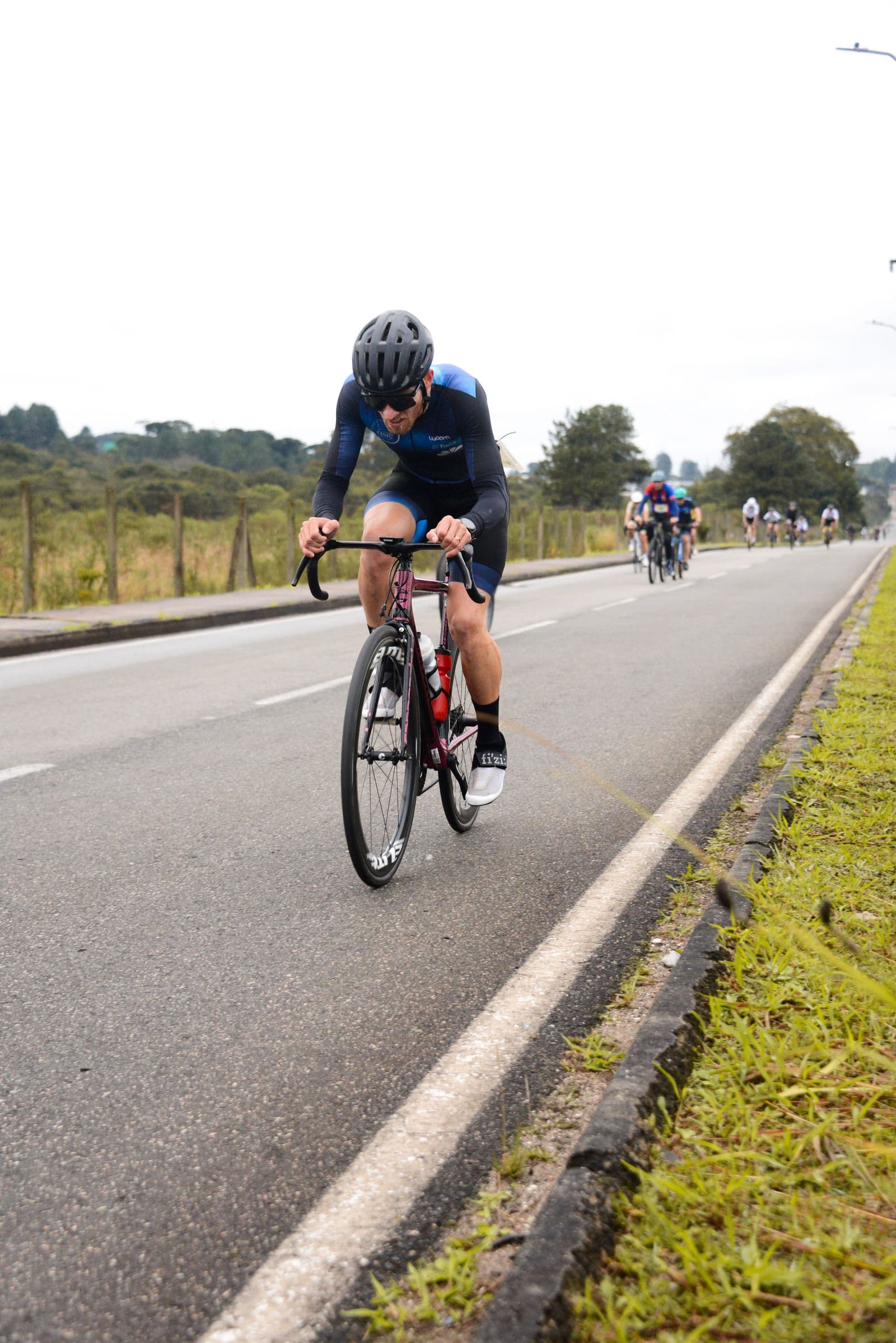 Cyclist mid-effort showing riding position