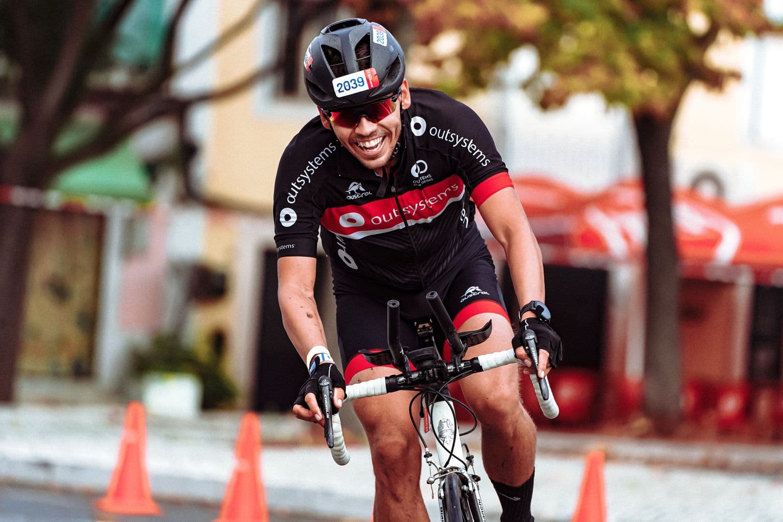 Cyclist's hands gripping road handlebars