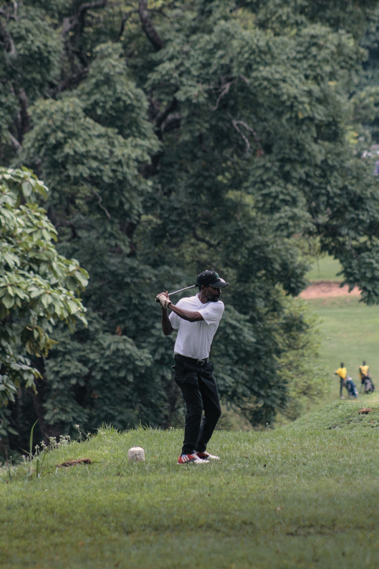 Golfer taking a practice swing on the course
