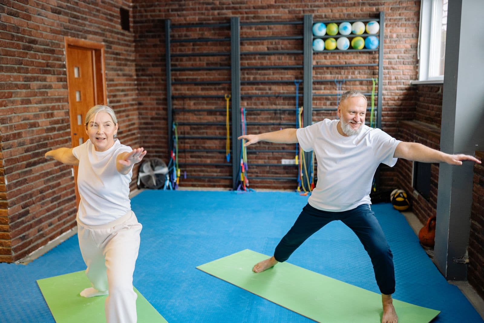 Older couple practicing balance exercises together