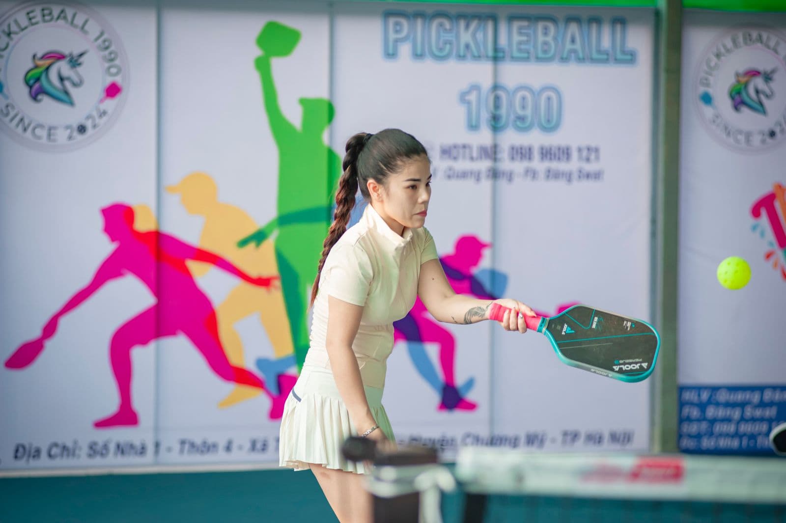 Player returning a shot during a pickleball game