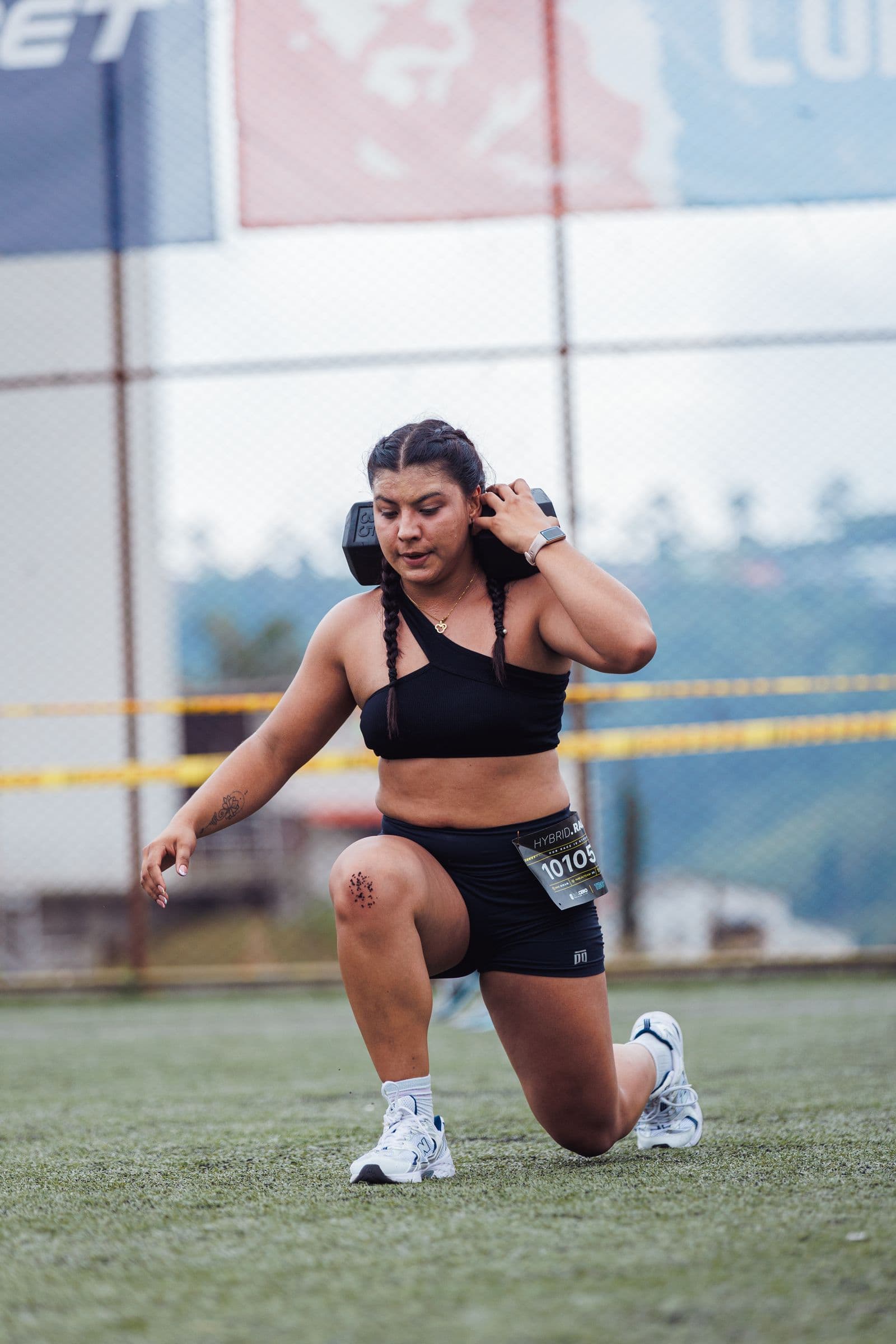 Athlete performing weighted lunges outdoors