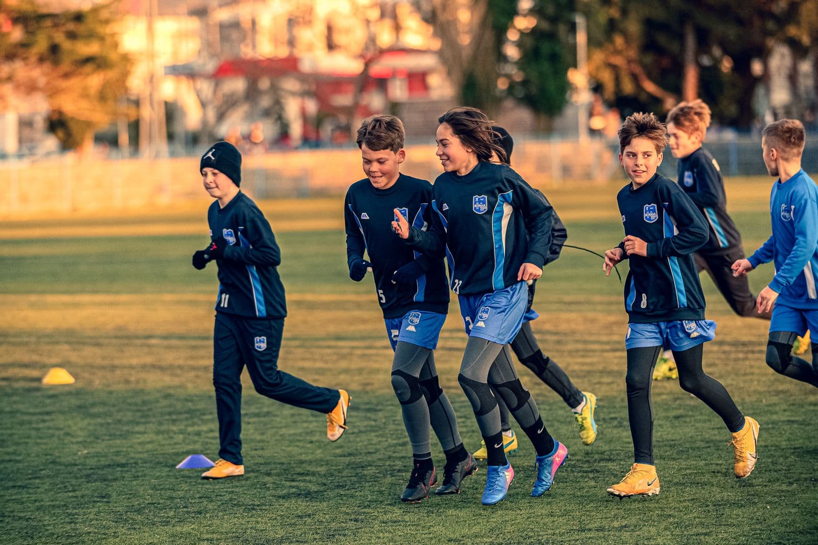 Young players running during a soccer practice