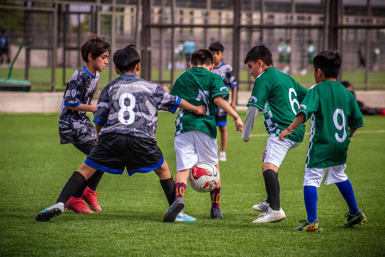 Young soccer players running warm-up drills