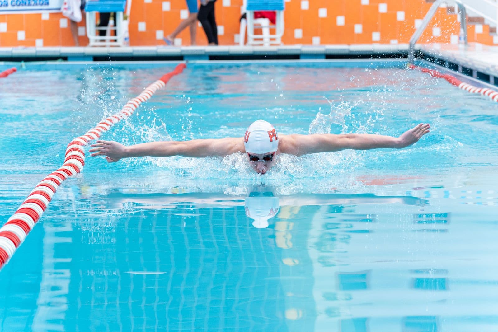 Swimmer powering through a butterfly stroke